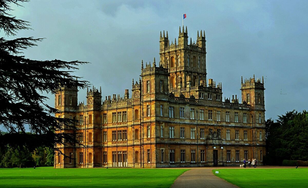 Seeing Highclere Castle, the stand-in for the fictional "Downton Abbey," on the big screen is like a homecoming.