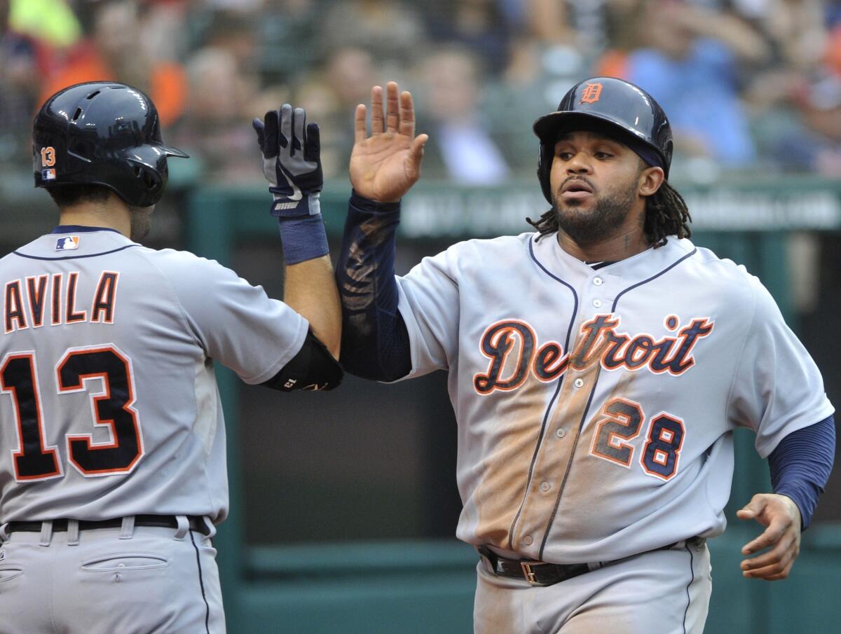 Detroit Tigers first baseman Prince Fielder, right, is congratulated by teammate Alex Avila after scoring a run against the Cleveland Indians on Thursday. Are the Tigers destined to win the AL Central?