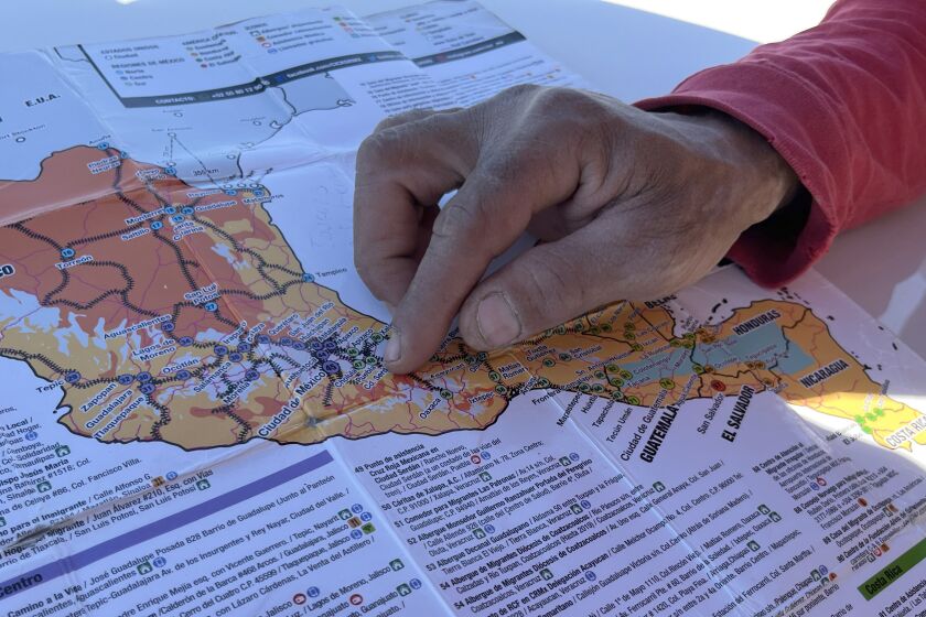 Robert Connell, a Venezuelan migrant in transit in Tijuana, points in the map he used to travel across Central America and Mexico to get to the border with the United States, where he is requesting asylum, on Jan. 26, 2023 in Tijuana, Baja California, Mexico.