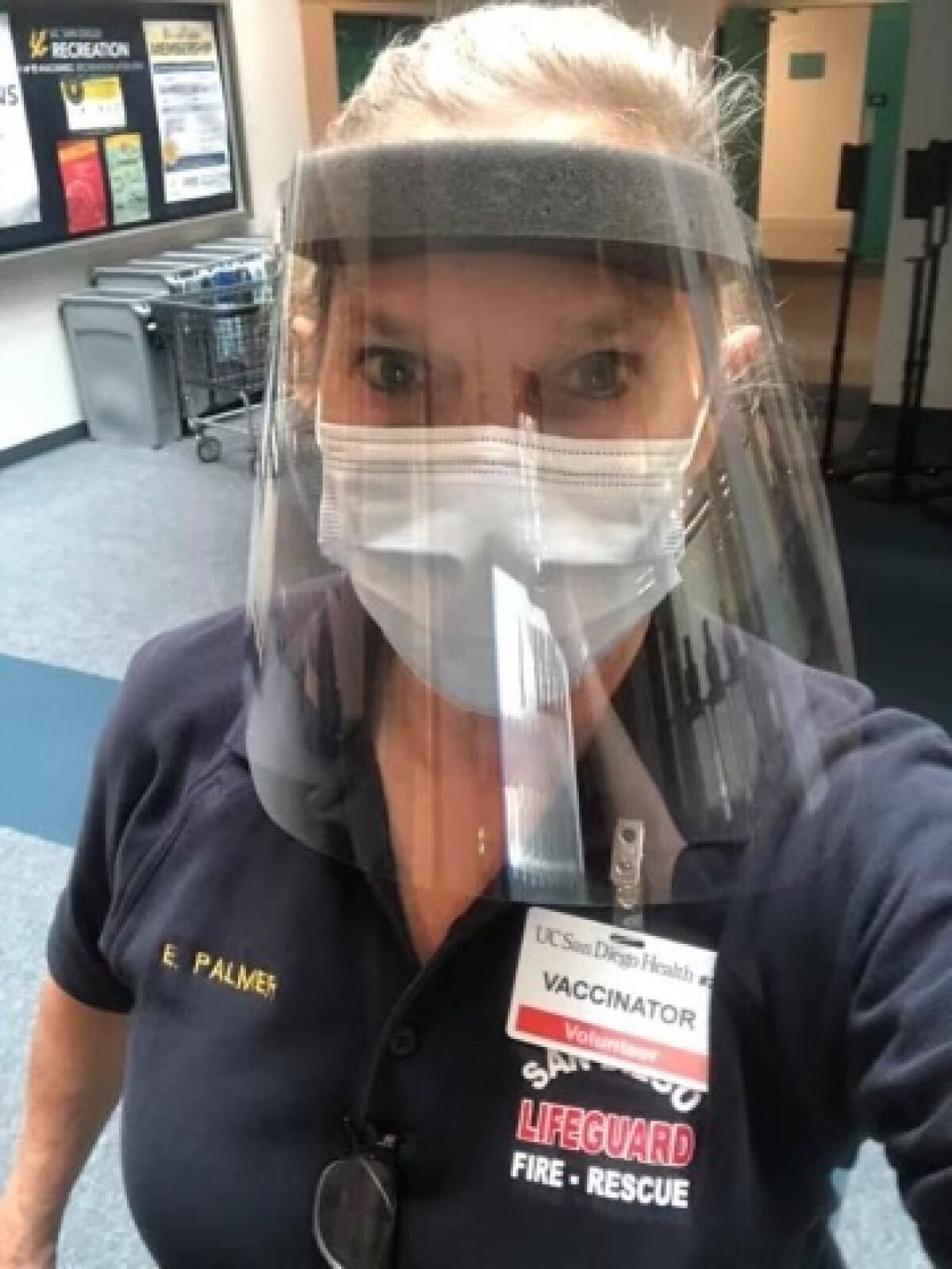 La Jolla lifeguard Elizabeth Palmer trained at UC San Diego's RIMAC arena to vaccinate others against COVID-19.