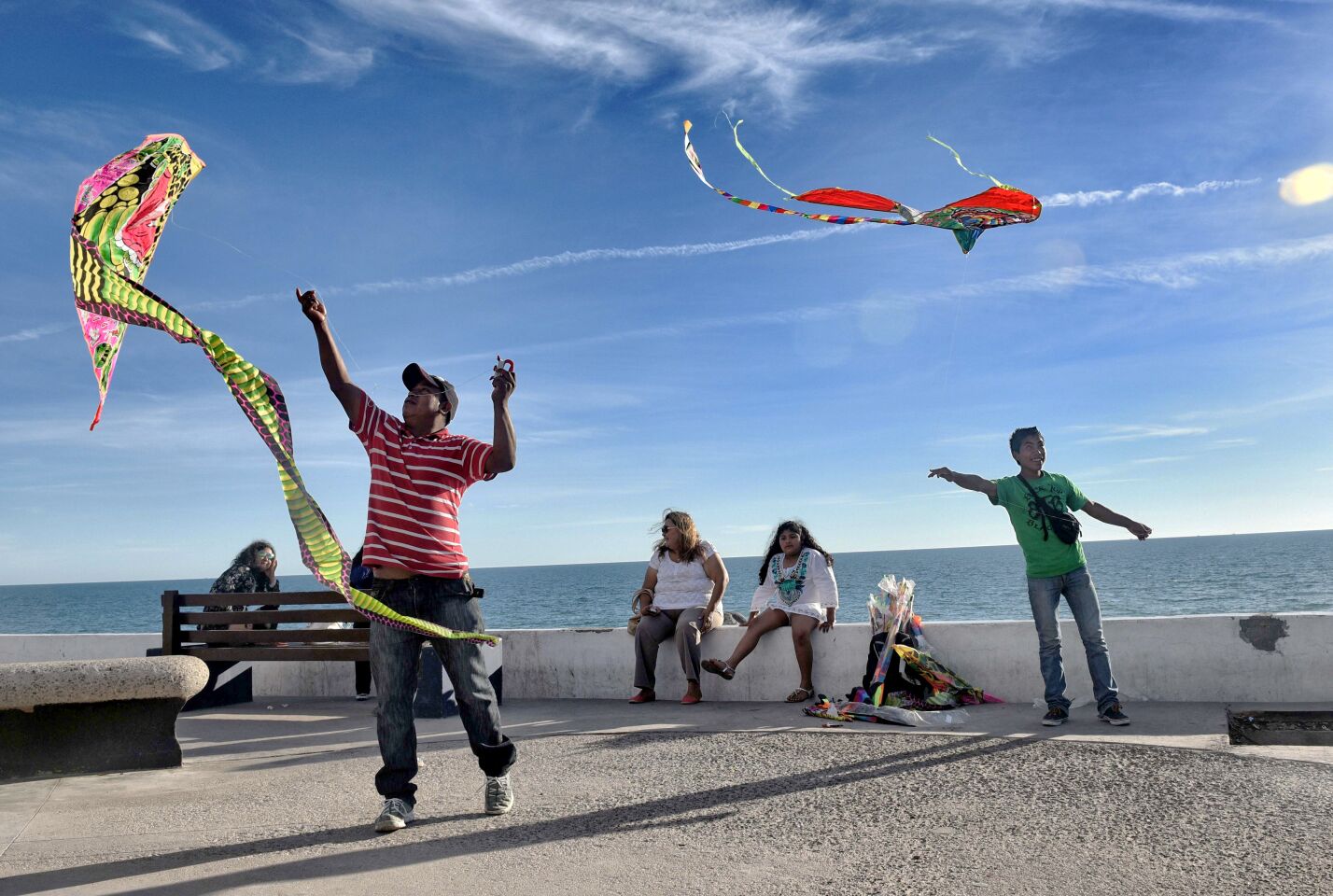People fly kites along the malecon in Puerto Peñasco, Sonora state, Mexico.