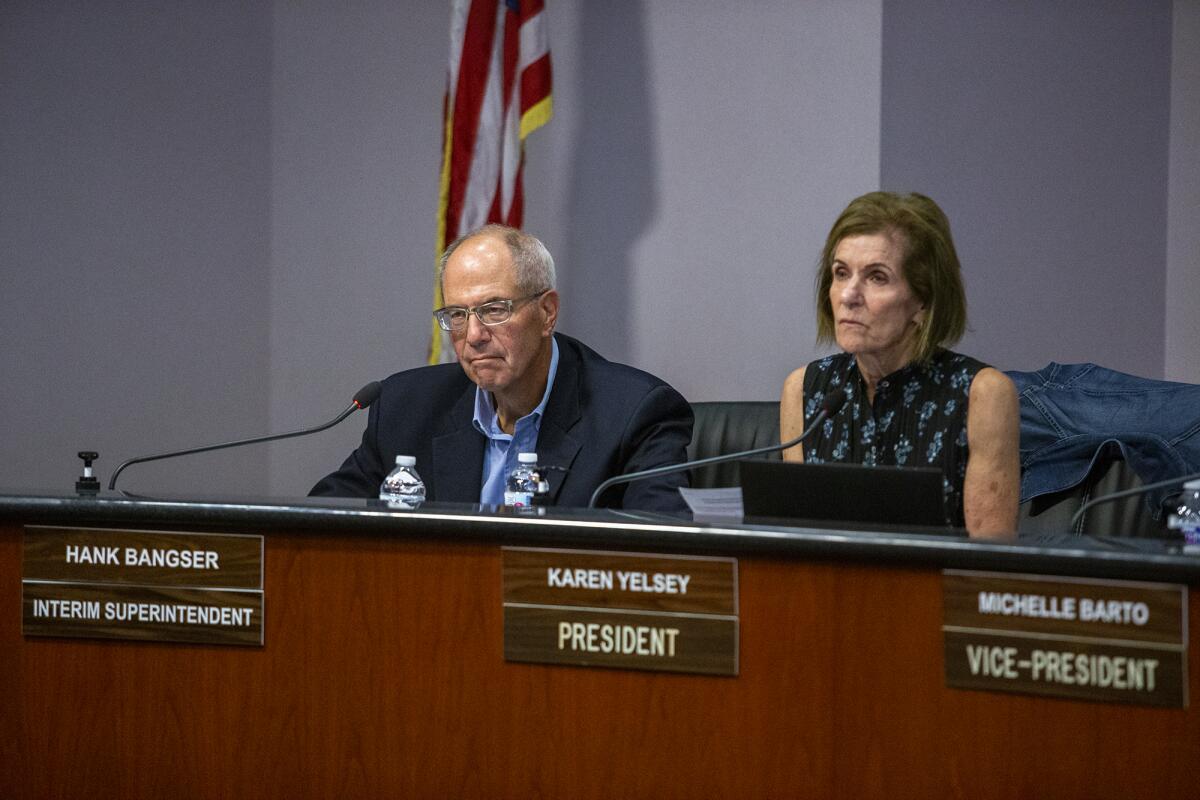Newport Mesa Unified Interim Superintendent Hank Bangser and Board President Karen Yelsey during a board meeting Tuesday.