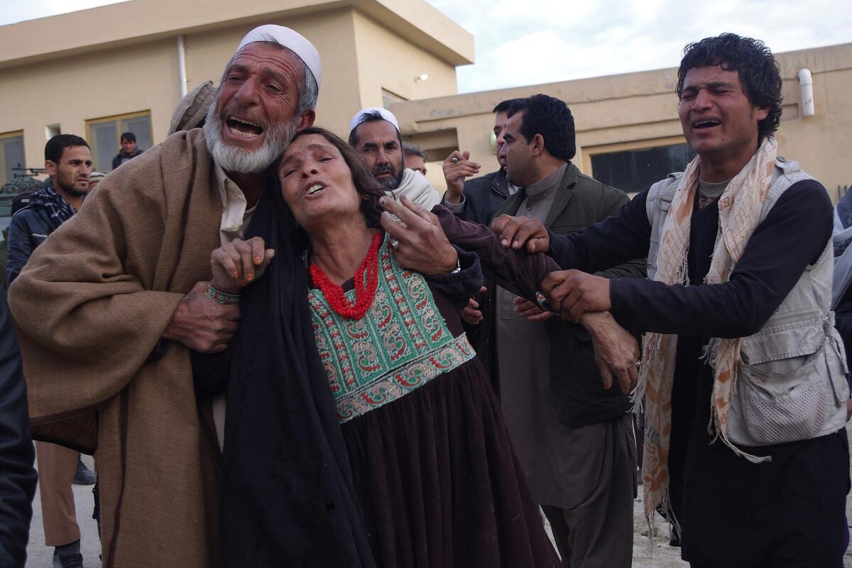 Relatives weep for victims of a suicide attack on a funeral in Afghanistan's Laghman province on Jan. 29.