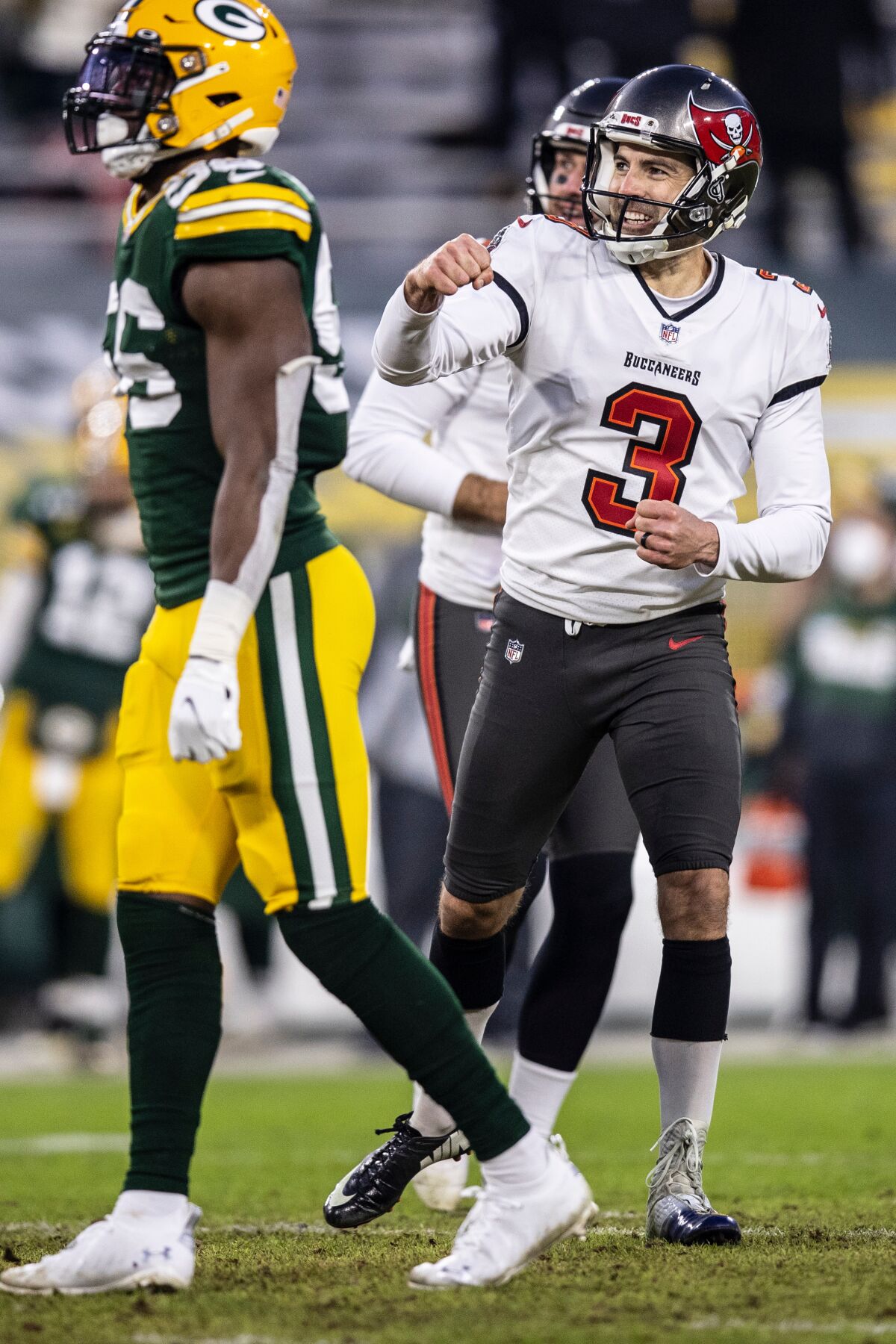 Tampa Bay kicker Ryan Succop, right, celebrates during the Buccaneers' 31-24 win over Green Bay on Jan. 24.