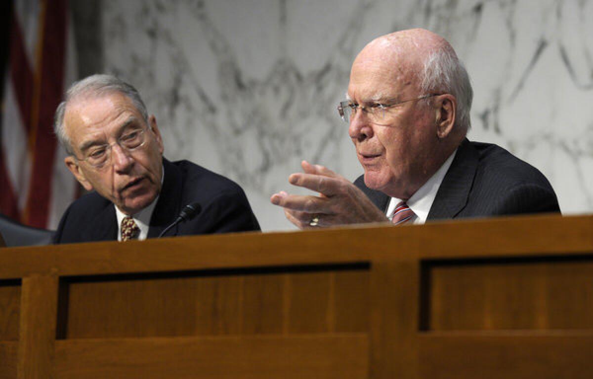 Senate Judiciary Committee Chairman Sen. Patrick Leahy (D-Vt.), left, accompanied by Republican Sen. Charles E. Grassley (R-Iowa).