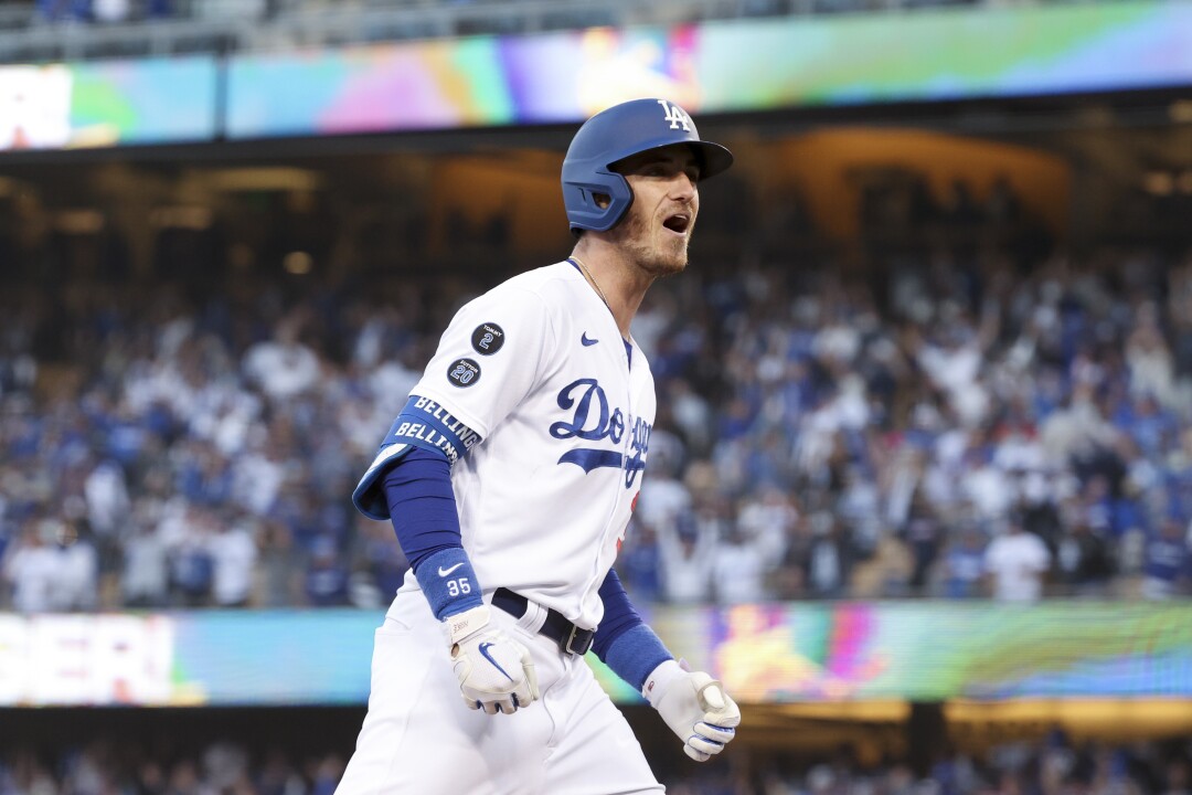 Los Angeles Dodgers' Cody Bellinger celebrates victory after home run with three rounds to level the score in the eighth inning.