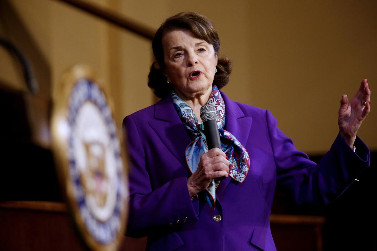 A woman holds a microphone.