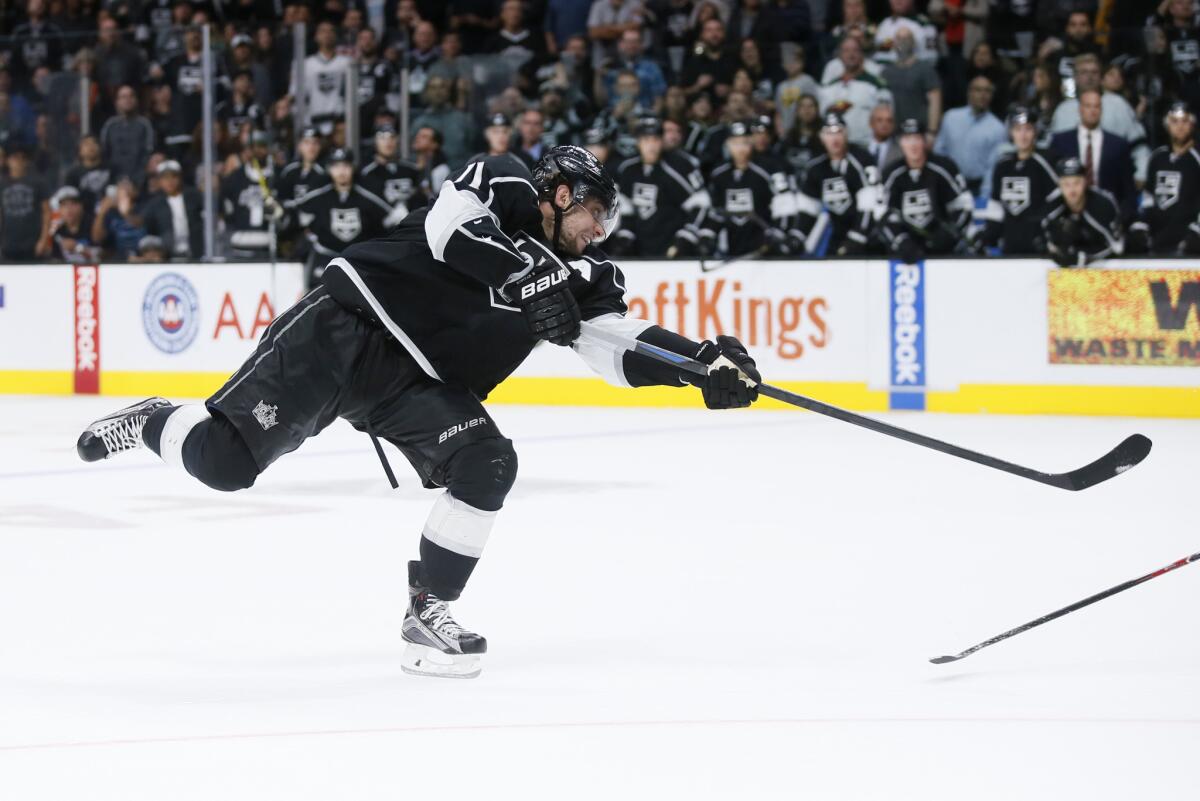 Kings center Anze Kopitar unleashes the game-winning shot against the Wild in overtime Friday night at Staples Center.