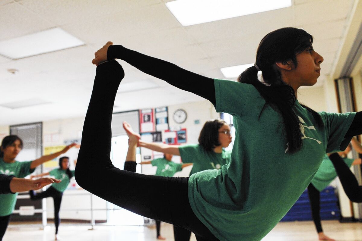 Eighth-grader Lydia Lopez practices contemporary dance at Gabriella Charter School, which has been attracting attention for the high achievement of its students.