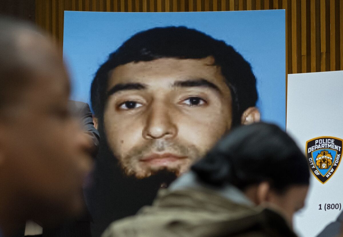 FILE - A photo of Sayfullo Saipov is displayed at a news conference at One Police Plaza in New York, Nov. 1, 2017. About 200 potential jurors for the trial of Saipov, charged with killing eight people on a New York City bike path in a terror attack, have filled out questionnaires posing questions about the death penalty. (AP Photo/Craig Ruttle, File)