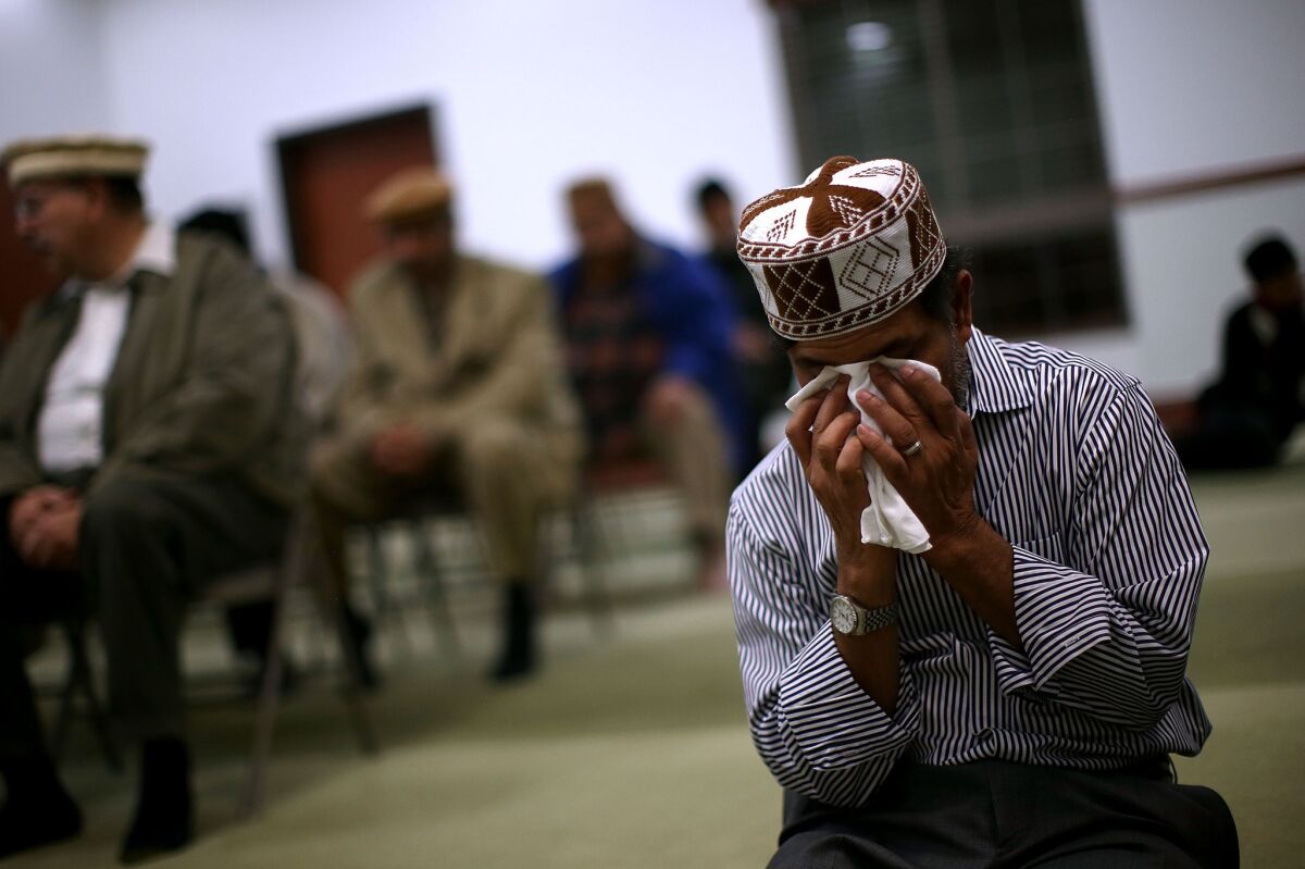 A man prays at a mosque in Chino following the San Bernardino shooting.