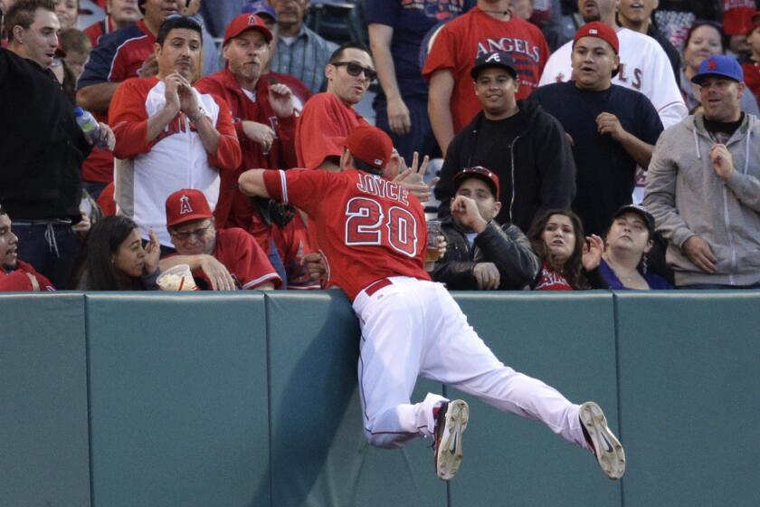 Los Angeles Angels' Matt Joyce catches a ball hit by Colorado Rockies' Wilin Rosario during the Angels' 5-2 win over the Rockies on Tuesday.