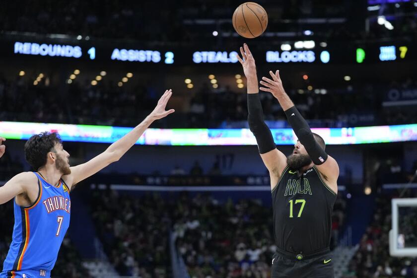 New Orleans Pelicans center Jonas Valanciunas (17) attempts a 3-point shot against Oklahoma City Thunder forward Chet Holmgren (7) in the first half of Game 4 of an NBA basketball first-round playoff series in New Orleans, Monday, April 29, 2024. (AP Photo/Gerald Herbert)
