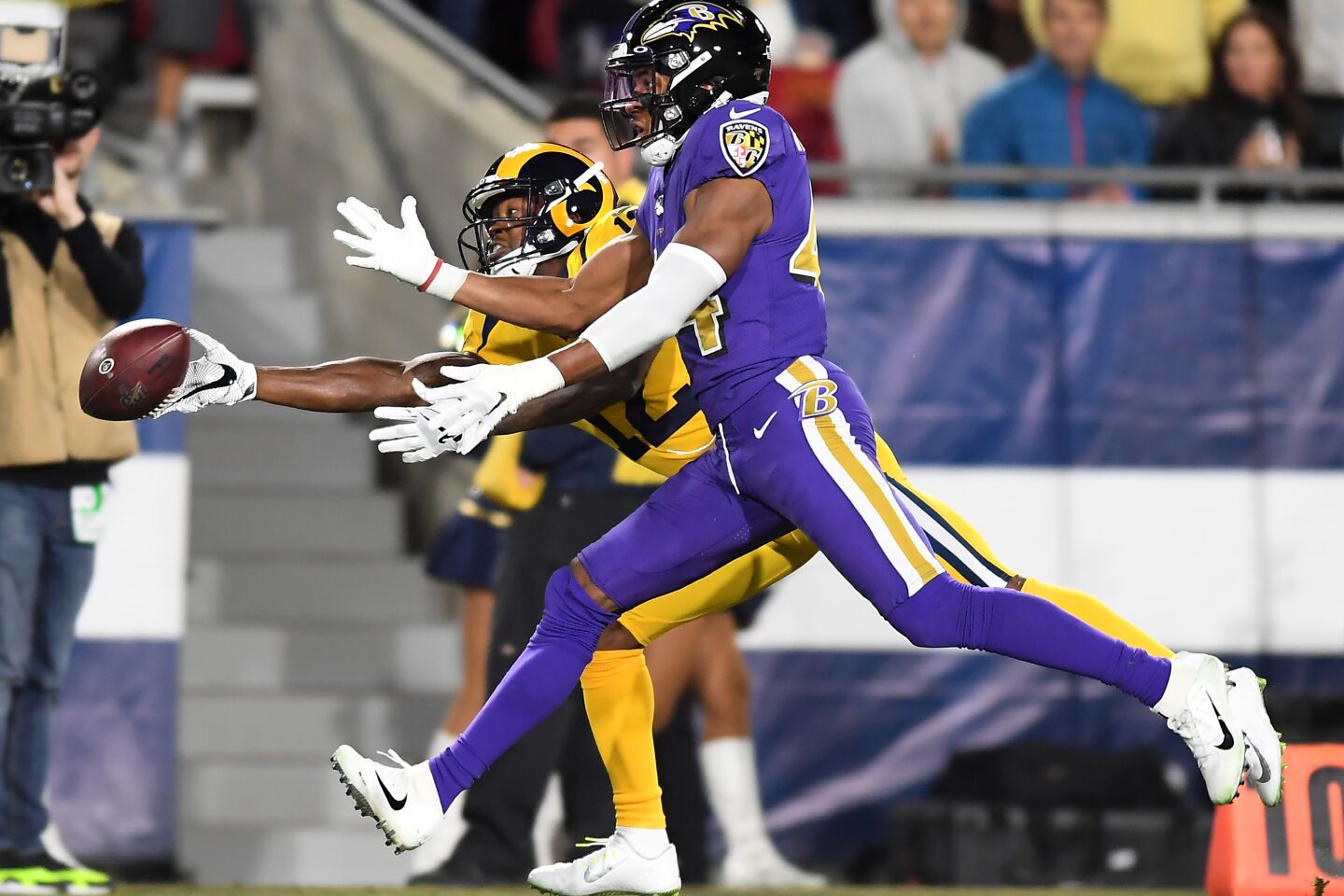 Rams receiver Robert Woods can't make the catch in front of Ravens cornerback Marlon Humphrey during the second quarter of a game Nov. 25 at the Coliseum.