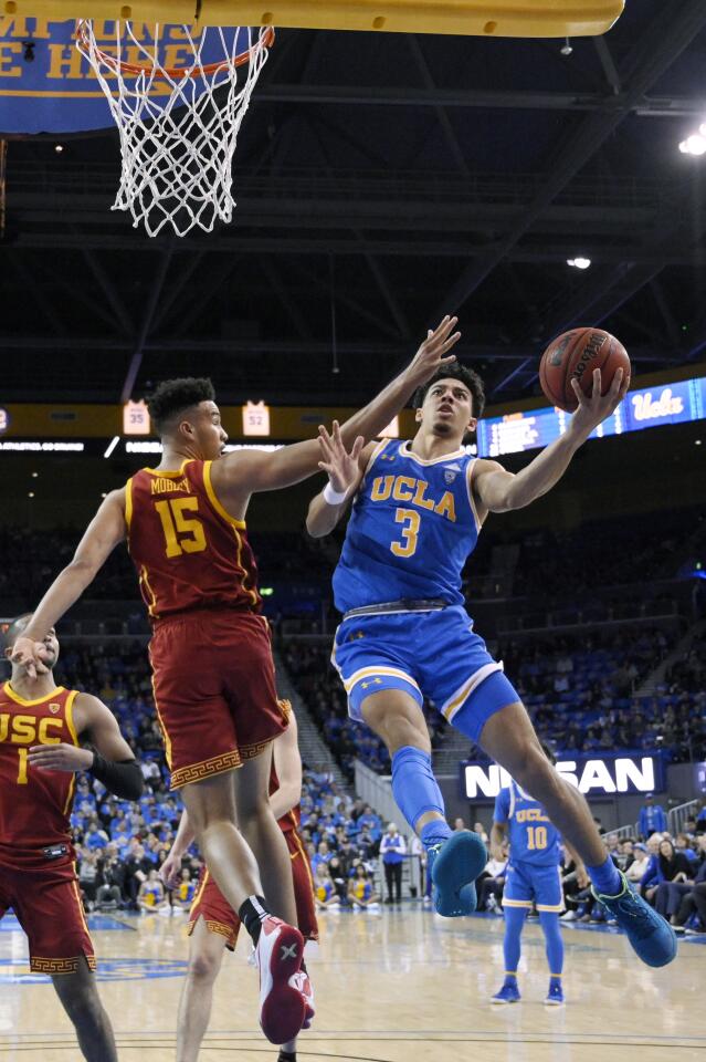 UCLA guard Jules Bernard puts up a shot against USC forward forward Isaiah Mobley defends during the first half of a game Jan. 11 at Pauley Pavilion.