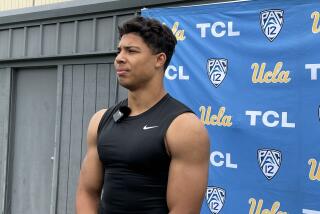 UCLA running back Zach Charbonnet talking at the end of Saturday's spring practice. He's up to 220 pounds.
