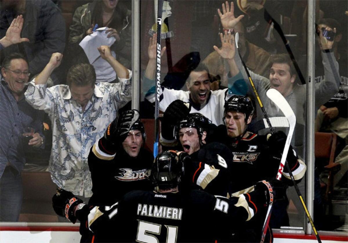 Fans and Ducks teammates celebrate a game-tying goal against the Chicago Blackhawks.