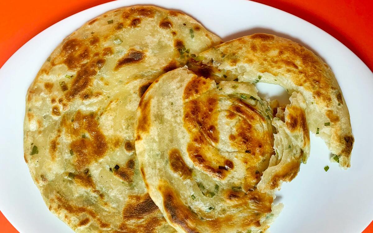 LOS ANGELES, CA.,(May 1, 2020) How to boil water -scallion pancakes (Geneveive Ko/ Los Angeles Times)