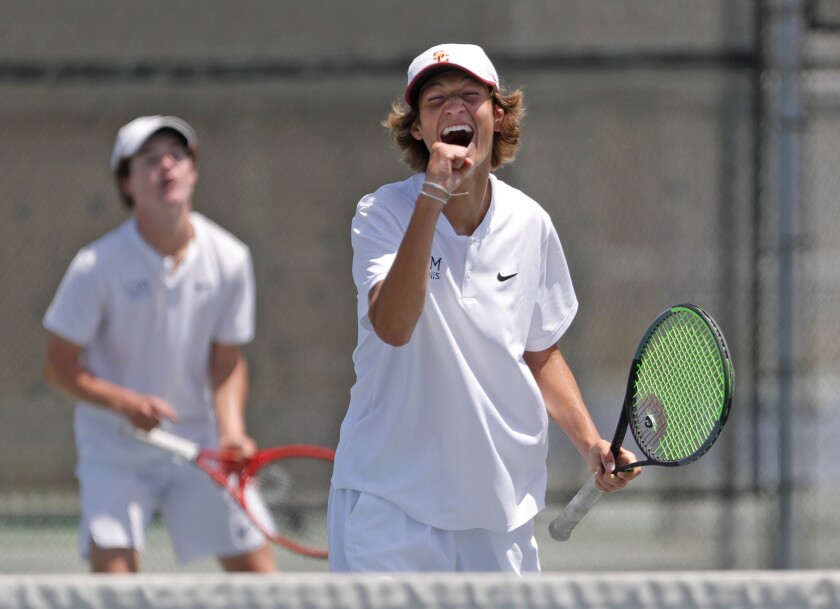 Niels Hoffmann of Corona del Mar reacts to winning a long rally at the net with doubles partner Jack Cross.