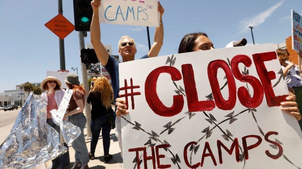 Demonstrators call for the closure of immigrant detention camps in front of Rep. Karen Bass' office in Los Angeles on Tuesday.