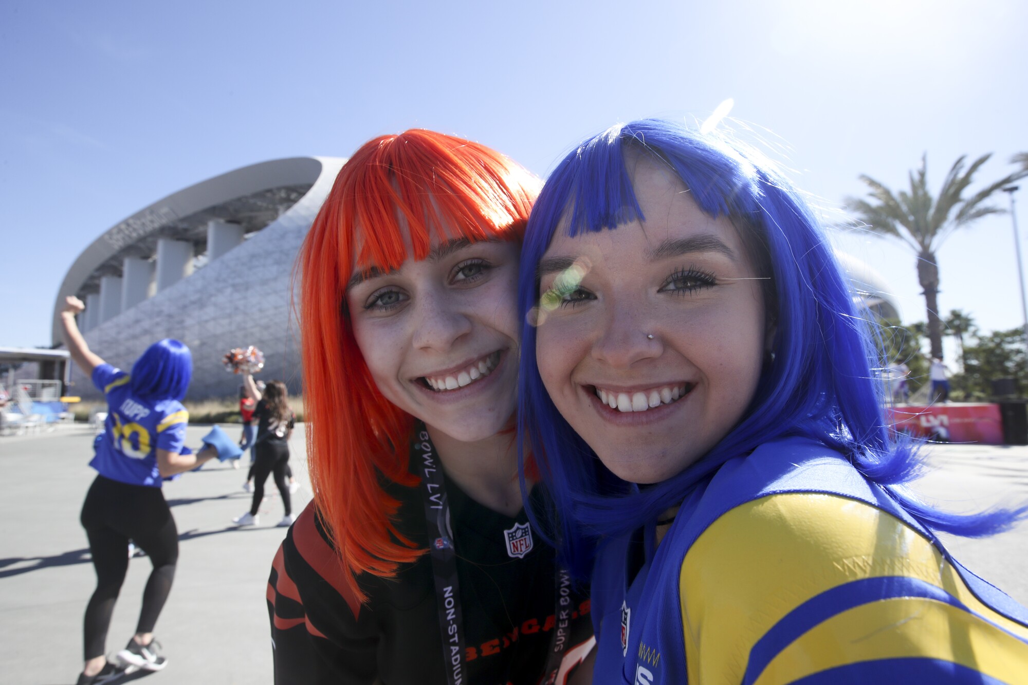 Rams and Bengals fans sport their team's colors before Super Bowl LVI at SoFi Stadium.