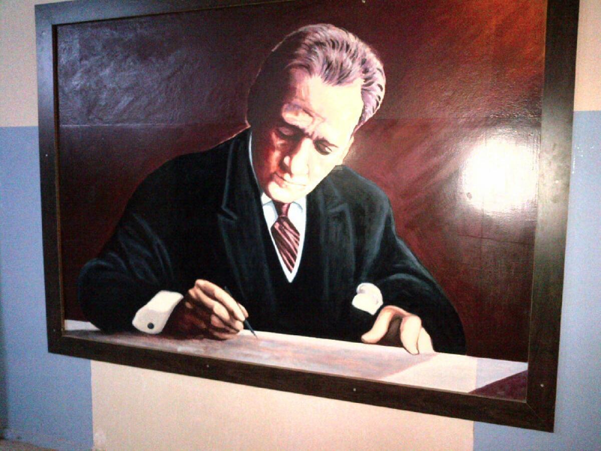 Haj Kadour's painting of Kemal Ataturk, the founder of modern Turkey, adorns a wall on the second floor of a vocational high school named after the leader in Reyhanli, Turkey. There is a waiting list of Reyhanli schools that want to hire the artist, said Necmetin Yumusak, the school's principal, who called him a "maestro."