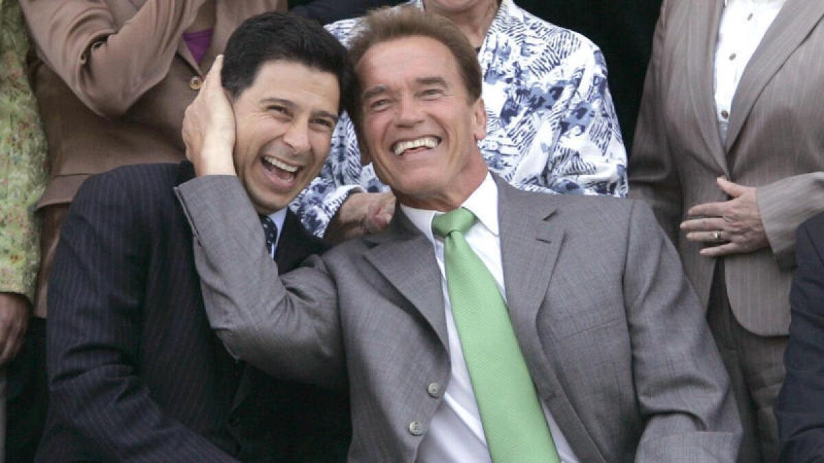 Former Gov. Arnold Schwarzenegger, right, and former Assembly Speaker Fabian Nuñez in 2007. As his term was ending, Schwarzenegger commuted the sentence of Nuñez's son, Esteban, who was serving a 16–year sentence for his role in the fatal stabbing of a San Diego college student.