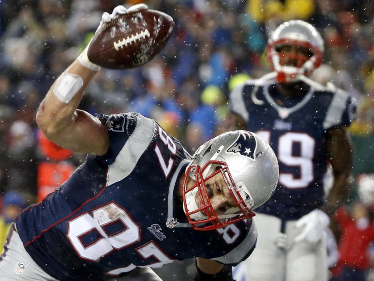 Patriots tight end Rob Gronkowski spikes the football after scoring a touchdown in the Patriots rout of the Colts.