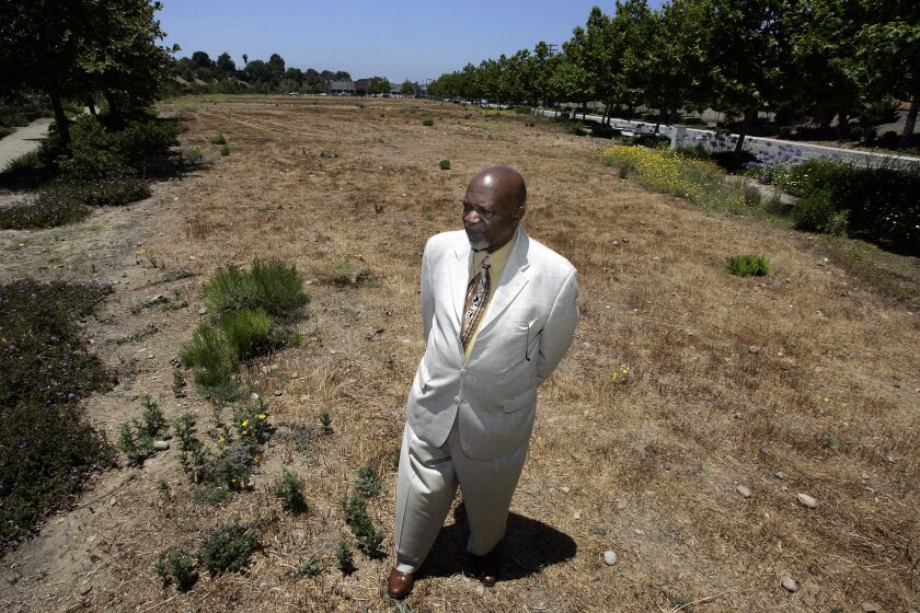 In this 2008 photo, Bishop George D. McKinney shares his plans and hopes to develop this 4-acre lot