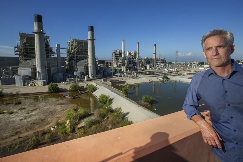 REDONDO BEACH, CA-NOVEMBER 22, 2019: Redondo Beach Mayor Bill Brand is photographed next to the AES Power Plant in Redondo Beach that is currently supposed to close in 2020 due to environmental regulations. California’s State Water Resources Control Board is considering a request from the Public Utilities Commission to allow this power plant to stay open longer. Brand is opposed to the extension. (Mel Melcon/Los Angeles Times)