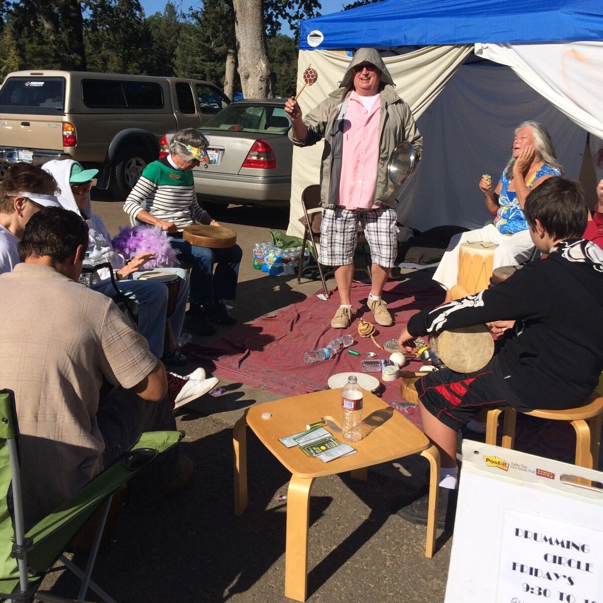 Evacuees from the Valley fire participate in a drum circle at a Red Cross disaster center set up at the Calistoga Fairgrounds.