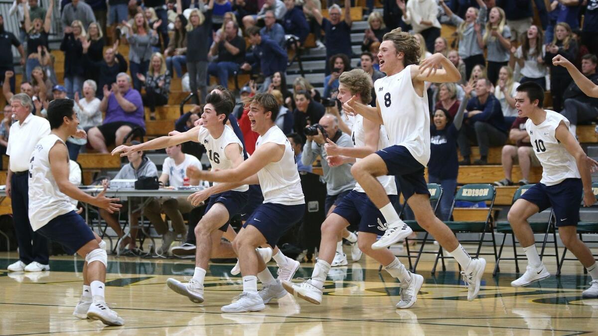 Newport Harbor High, shown celebrating a win over rival Corona del Mar in the Orange County Championships final on March 19, 2018, is 16-0 this boys' volleyball season.