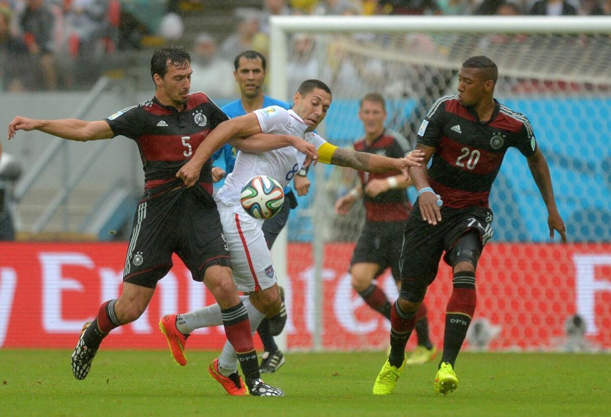 Clint Dempsey of the U.S., center, battles with Germany's Mats Hummels, left, and Jerome Boateng, right, during Team USA's 1-0 loss to the Germans.