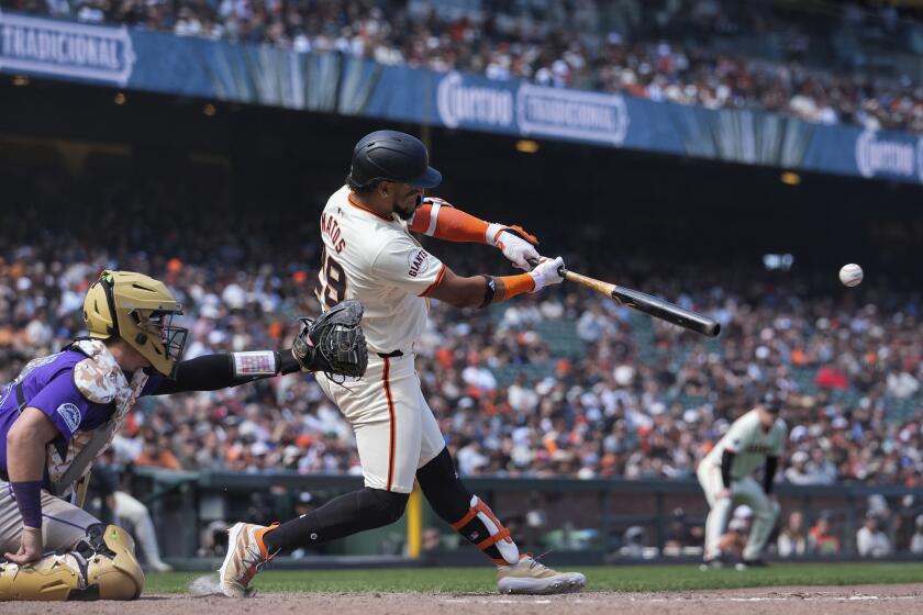 San Francisco Giants' Luis Matos hits a two-run single against the Colorado Rockies during the eighth inning of a baseball game Saturday, May 18, 2024, in San Francisco. (AP Photo/Godofredo A. Vásquez)