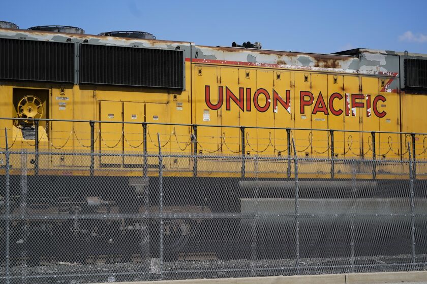 FILE - A Union Pacific train engine sits in a rail yard on Wednesday, Sept. 14, 2022, in Commerce, Calif. Union Pacific said Saturday, March 25, 2023, that the company has backed away from the industry's longstanding push to cut train crews down to one person as lawmakers and regulators increasingly focus on rail safety following last month's fiery derailment in Ohio. (AP Photo/Ashley Landis, File)