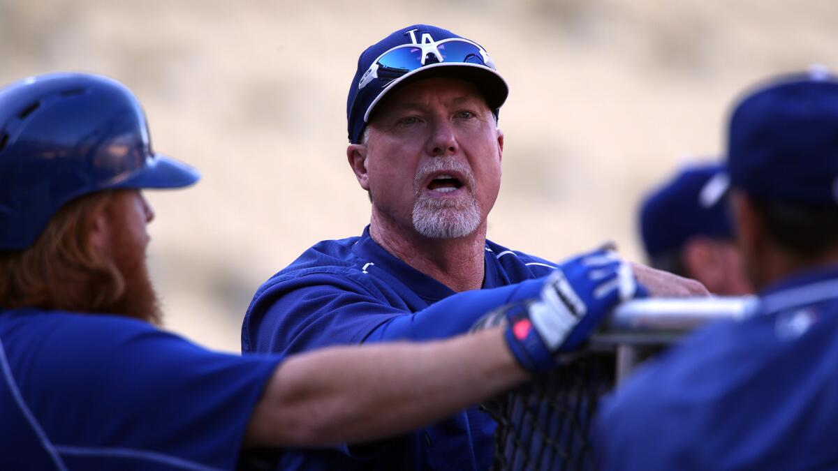 Mark McGwire cites sons' HS baseball as reason for leaving Padres