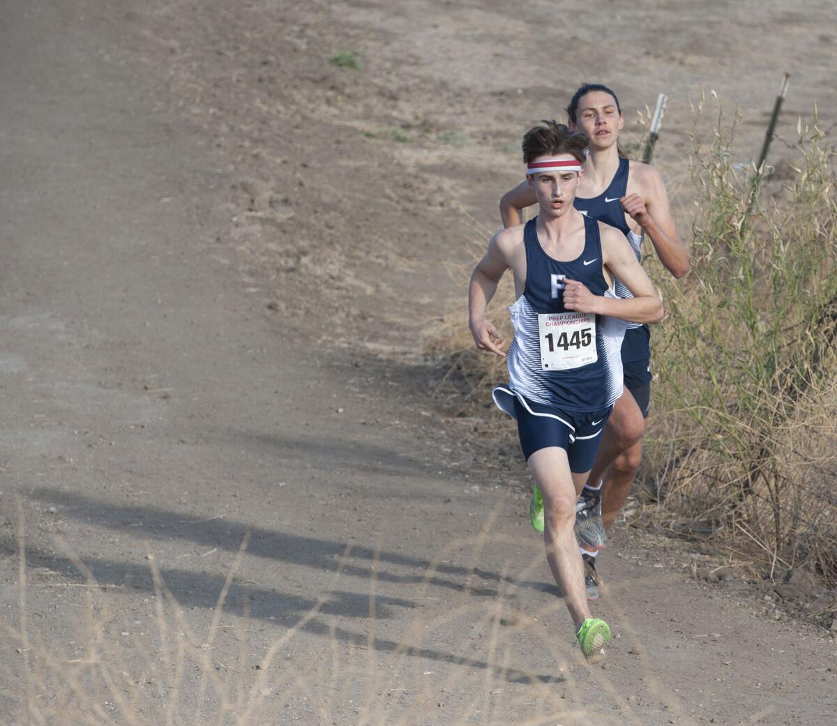 Flintridge Prep's Bennett Oakes (front) and Hudson Billock break away from the pack to lead the boys' race at Saturday's Prep League finals at Los Angeles Pierce College.