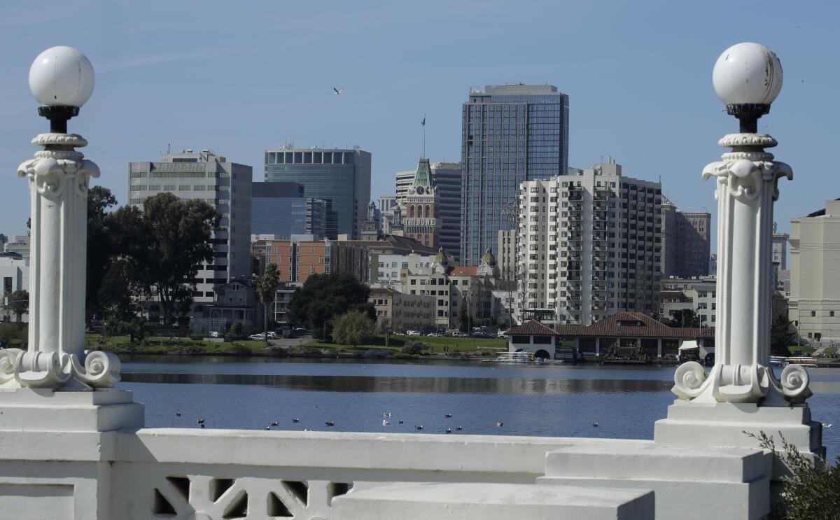 The Oakland skyline is seen from Lake Merritt on Wednesday, March 4, 2020, in Oakland, Calif. 