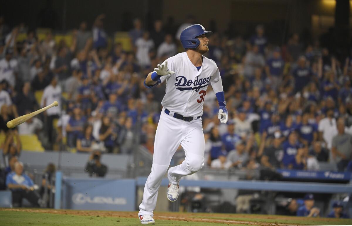 Cody Bellinger tosses his bat after hitting a two-run home run during the fourth inning of the Dodgers' 5-2 loss to the San Diego Padres on Friday.