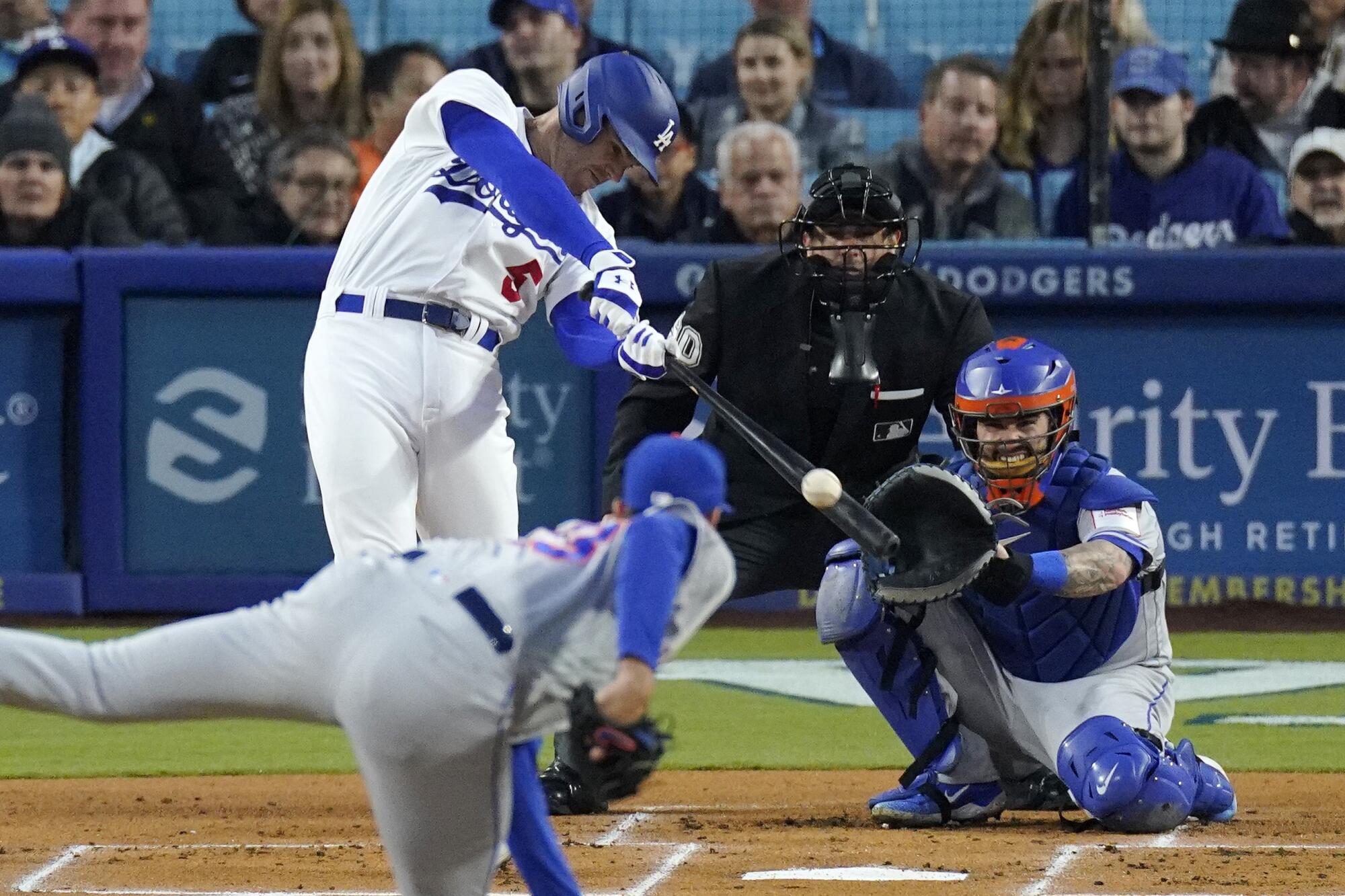 Los Angeles Dodgers' Freddie Freeman hits a home run against New York Mets pitcher David Peterson 