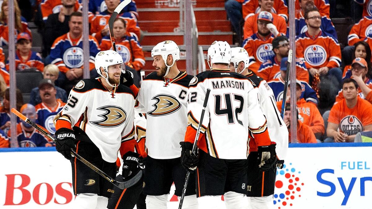 Captain Ryan Getzlaf celebrates with teammates after the Ducks scored a goal against the Oilers on Wednesday.