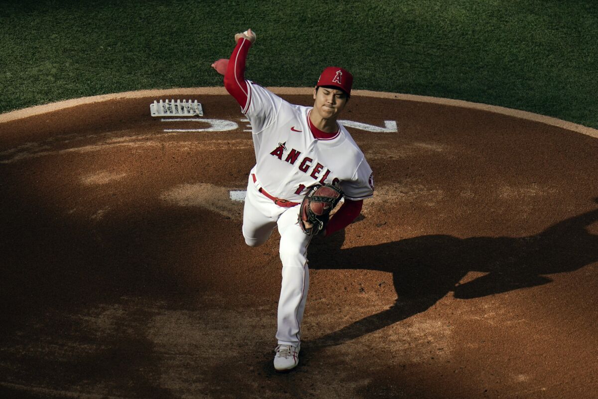 Angels starting pitcher Shohei Ohtani throws against Cleveland on Wednesday at Angel Stadium.
