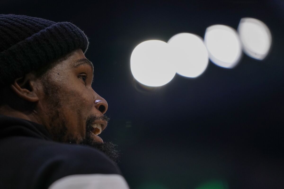 Brooklyn Nets' Kevin Durant yells to teammates during the first half of an NBA basketball game against the Milwaukee Bucks Saturday, Feb. 26, 2022, in Milwaukee. (AP Photo/Morry Gash)
