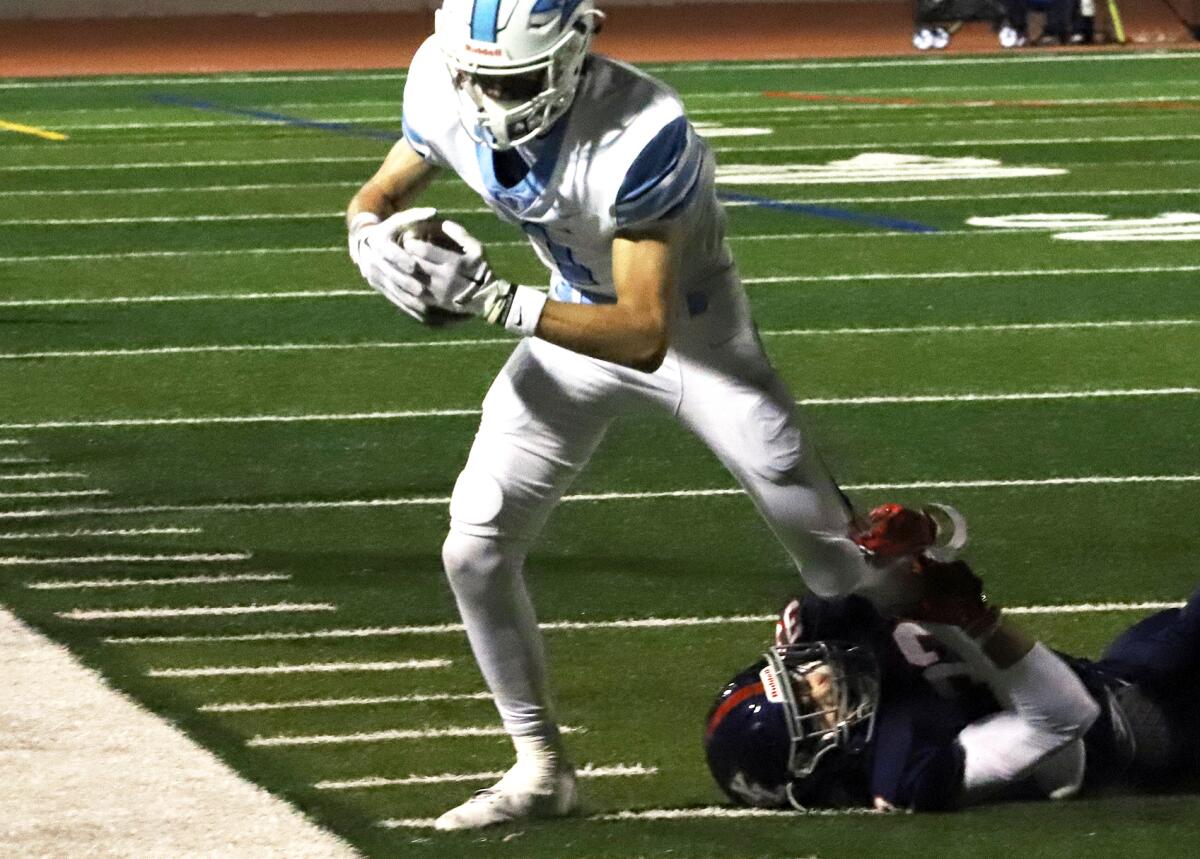 Corona del Mar's Cooper Hoch (1) makes a catch in the CIF Southern Section Division 3 football semifinal.