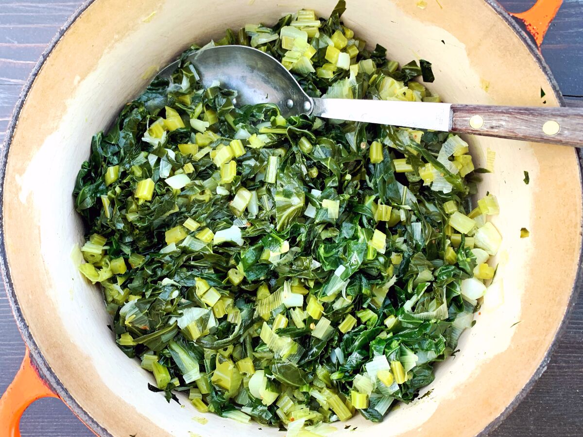 A pot of sautéed collard greens is one of the easiest vegetarian dishes to make and keep around.
