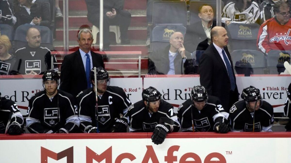 Kings Coach Darryl Sutter watches the action from the bench during the third period of a game against the Capitols on Feb. 5.