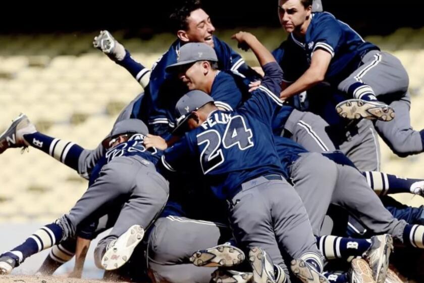 Birmingham players celebrate at Dodger Stadium in 2017 City Section final. The game returns to Dodger Stadium on May 27.