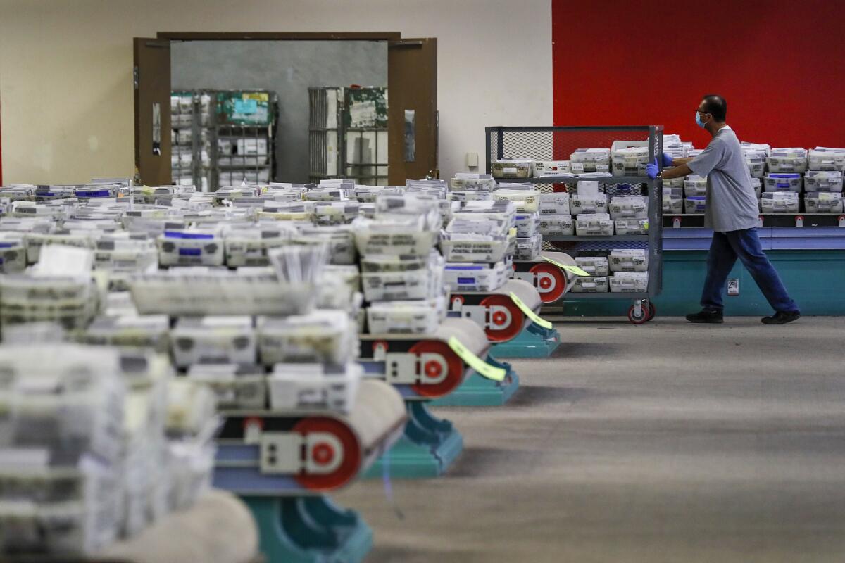 Ballots are received, sorted and verified at the LA County ballot processing facility