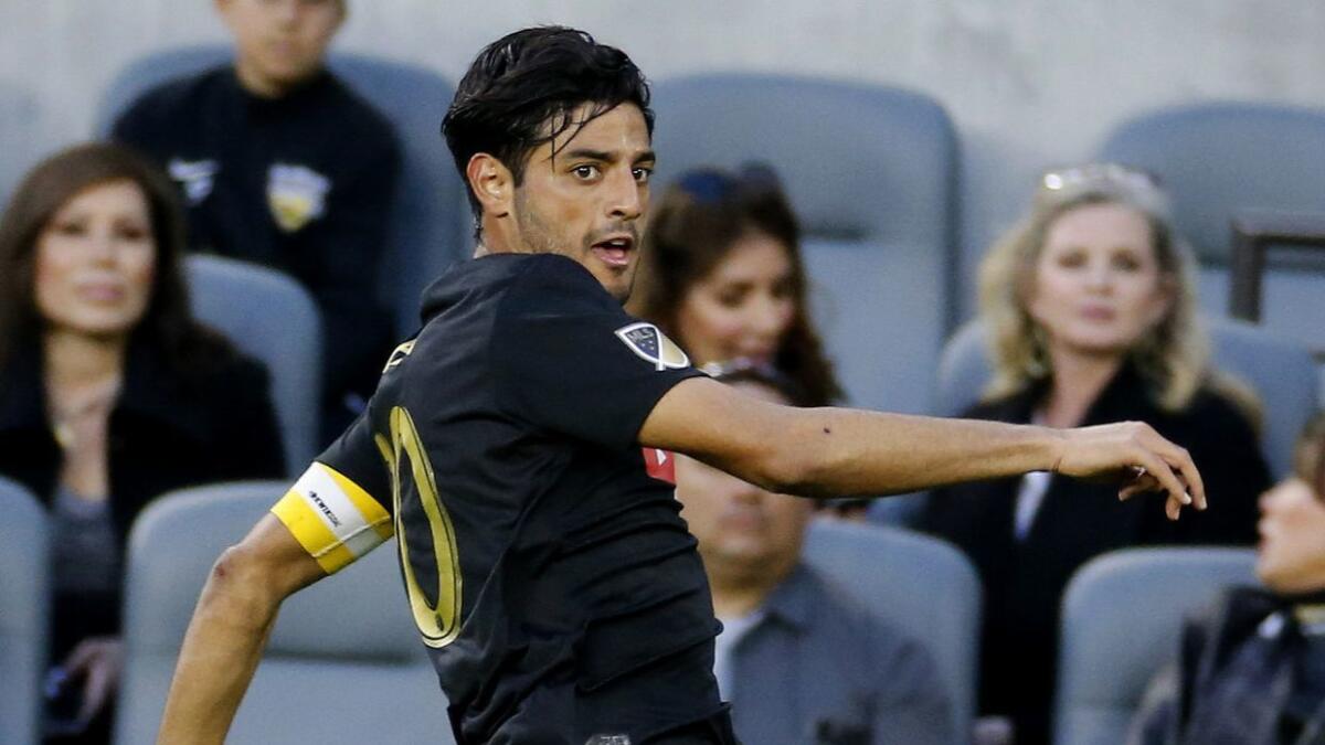 LAFC forward Carlos Vela controls the ball during a match against the Portland Timbers in March.