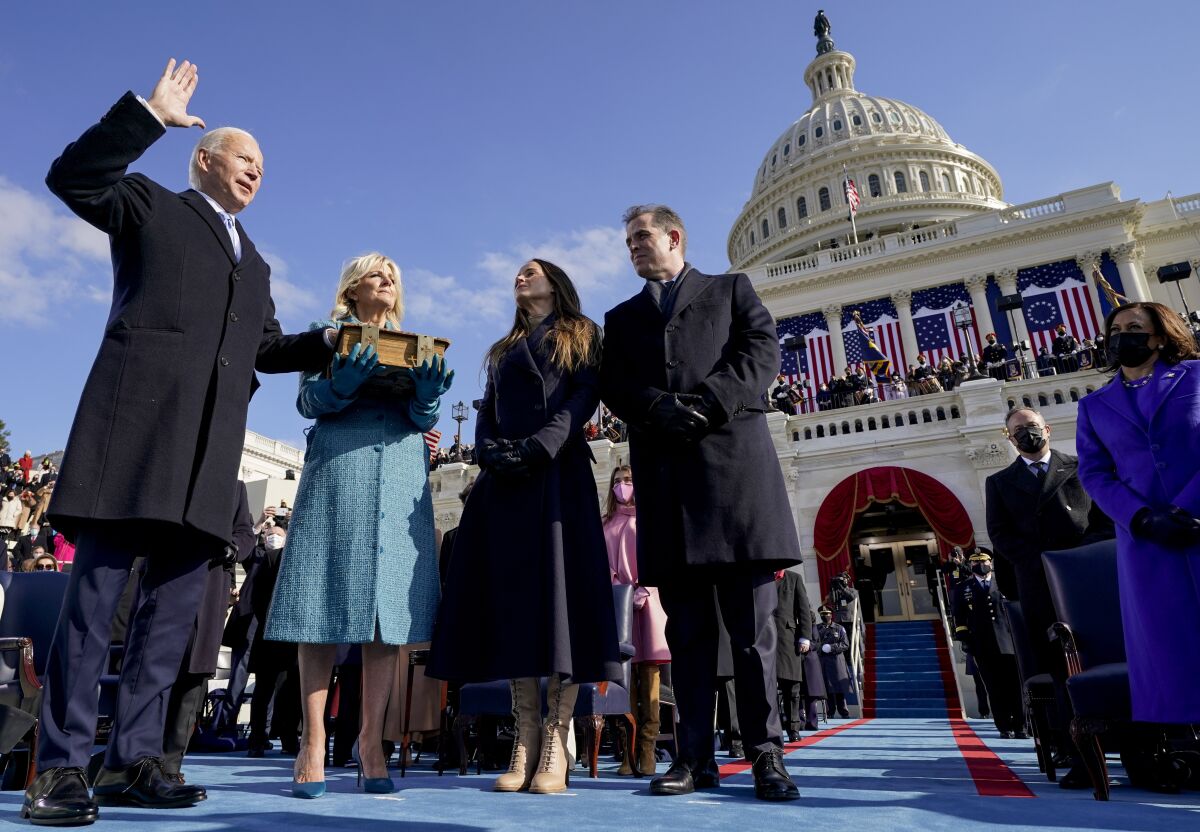 FILE - Joe Biden is sworn in as the 46th president of the United States by Chief Justice John Roberts as Jill Biden holds the Bible during the 59th Presidential Inauguration at the U.S. Capitol in Washington, on Jan. 20, 2021, as their children Ashley and Hunter watch.(AP Photo/Andrew Harnik, Pool, File)